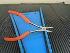 #AP866 Cornwell Tools CPL1205 Orange Duck Bill Pliers Used. Price: $14.97.